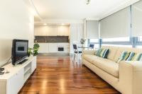 A television and/or entertainment centre at Melenara Beach Avenue Apt Shared Terrace
