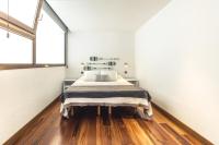 A bed or beds in a room at Melenara Beach Avenue Apt Shared Terrace