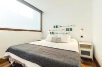 A bed or beds in a room at Melenara Beach Avenue Apt Shared Terrace