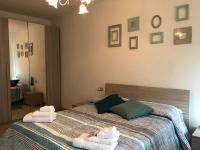 A bed or beds in a room at Val Giardino Vintage Cottage