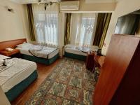Postel nebo postele na pokoji v ubytování Kadikoy Kervansaray Hotel