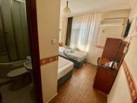 Postel nebo postele na pokoji v ubytování Kadikoy Kervansaray Hotel