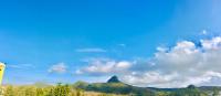 a view of the mountains under a cloudy sky at 墾丁大街Kenting Night Market-福賓別館 Fu Bin Inn in Kenting