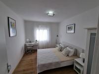 Posteľ alebo postele v izbe v ubytovaní Apartmani Mali