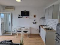 Kuchyňa alebo kuchynka v ubytovaní Apartmani Mali