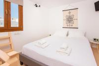 Postel nebo postele na pokoji v ubytování Whitelist Maisonette I and II in Mykonos Town