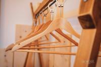 a bunch of wooden hangers on a wooden staircase at Le Saltimbanque - Auberge du Moulin in Eaucourt-sur-Somme