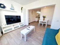 Televízia a/alebo spoločenská miestnosť v ubytovaní Apartamento Luca 05 en Playa Roca