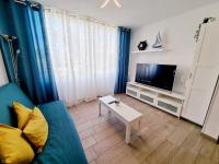 Televízia a/alebo spoločenská miestnosť v ubytovaní Apartamento Luca 05 en Playa Roca