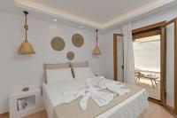 Posteľ alebo postele v izbe v ubytovaní Felicite apartments Naxos