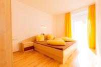 Postel nebo postele na pokoji v ubytování Appartements Avenzio