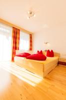 Postel nebo postele na pokoji v ubytování Appartements Avenzio