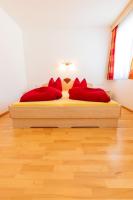 Postel nebo postele na pokoji v ubytování Appartements Avenzio