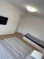 Postel nebo postele na pokoji v ubytování Apartmán Frymburk 30