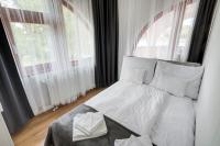 A bed or beds in a room at Fonyód Beach Apartment