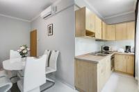 A kitchen or kitchenette at Fonyód Beach Apartment
