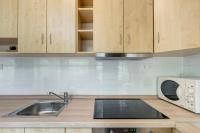 A kitchen or kitchenette at Fonyód Beach Apartment