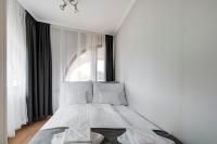 A bed or beds in a room at Fonyód Beach Apartment