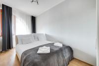 A bed or beds in a room at Fonyód Beach Apartment
