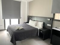 Posteľ alebo postele v izbe v ubytovaní 6 Bis HOTEL