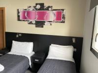 Posteľ alebo postele v izbe v ubytovaní 6 Bis HOTEL