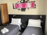 Posteľ alebo postele v izbe v ubytovaní 6 Bis HOTEL