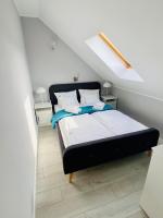 Posteľ alebo postele v izbe v ubytovaní Apartamenty Różany Ogród