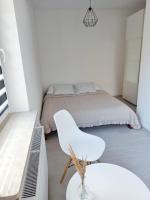 Posteľ alebo postele v izbe v ubytovaní Apartament Słoneczne Giżycko