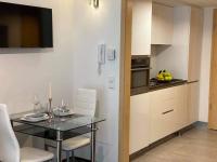 A kitchen or kitchenette at Relax and Spa - DeLux Apartman