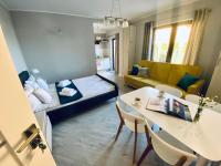 Posteľ alebo postele v izbe v ubytovaní Apartamenty Różany Ogród