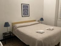 Posteľ alebo postele v izbe v ubytovaní Albergo Novecento