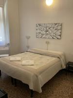 Posteľ alebo postele v izbe v ubytovaní Albergo Novecento