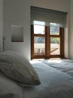 A bed or beds in a room at Piso modernista en casco histórico con garaje