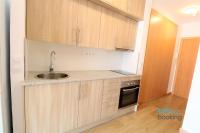 A kitchen or kitchenette at New Loft internacional , climatizado con piscina y playa.