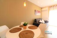 A seating area at New Loft internacional , climatizado con piscina y playa.