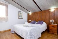 A bed or beds in a room at YourHouse Can Cuixa Villa