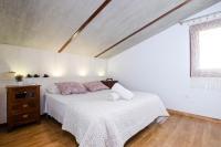 A bed or beds in a room at YourHouse Can Cuixa Villa
