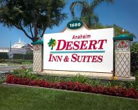 a sign for an amazon desert inn and suites at Anaheim Desert Inn & Suites in Anaheim