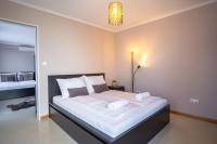 Posteľ alebo postele v izbe v ubytovaní MyFlat Belvedere Apartment