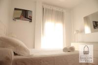 Postel nebo postele na pokoji v ubytování Apartamentos Balcón de la Vega