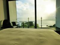 Postel nebo postele na pokoji v ubytování Sunshine Villa with Optionally Heated Pool 150m above Ocean & Sandy Beach