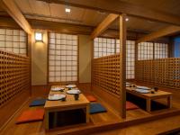 a room with two tables and chairs in it at ART HOTEL Miyazaki Sky Tower in Miyazaki