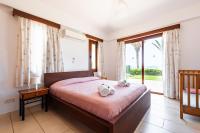 Postel nebo postele na pokoji v ubytování Seafront Villa Ocean Pearl - Private Beach Area & Pool