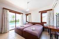 Postel nebo postele na pokoji v ubytování Seafront Villa Ocean Pearl - Private Beach Area & Pool
