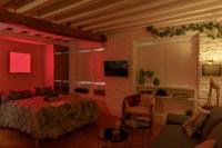 A television and/or entertainment centre at My Granada Garden - Catedral Lux Suite