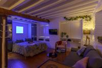 A television and/or entertainment centre at My Granada Garden - Catedral Lux Suite