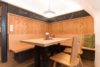 a dining room with a table and two chairs at Das Geringer in Schladming