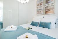 Postel nebo postele na pokoji v ubytování Baltini Premium Apartament Bliżej Morza