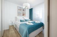Postel nebo postele na pokoji v ubytování Baltini Premium Apartament Bliżej Morza