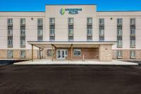 una representación de la parte delantera de un hotel enérgico en WoodSpring Suites Linden, en Linden